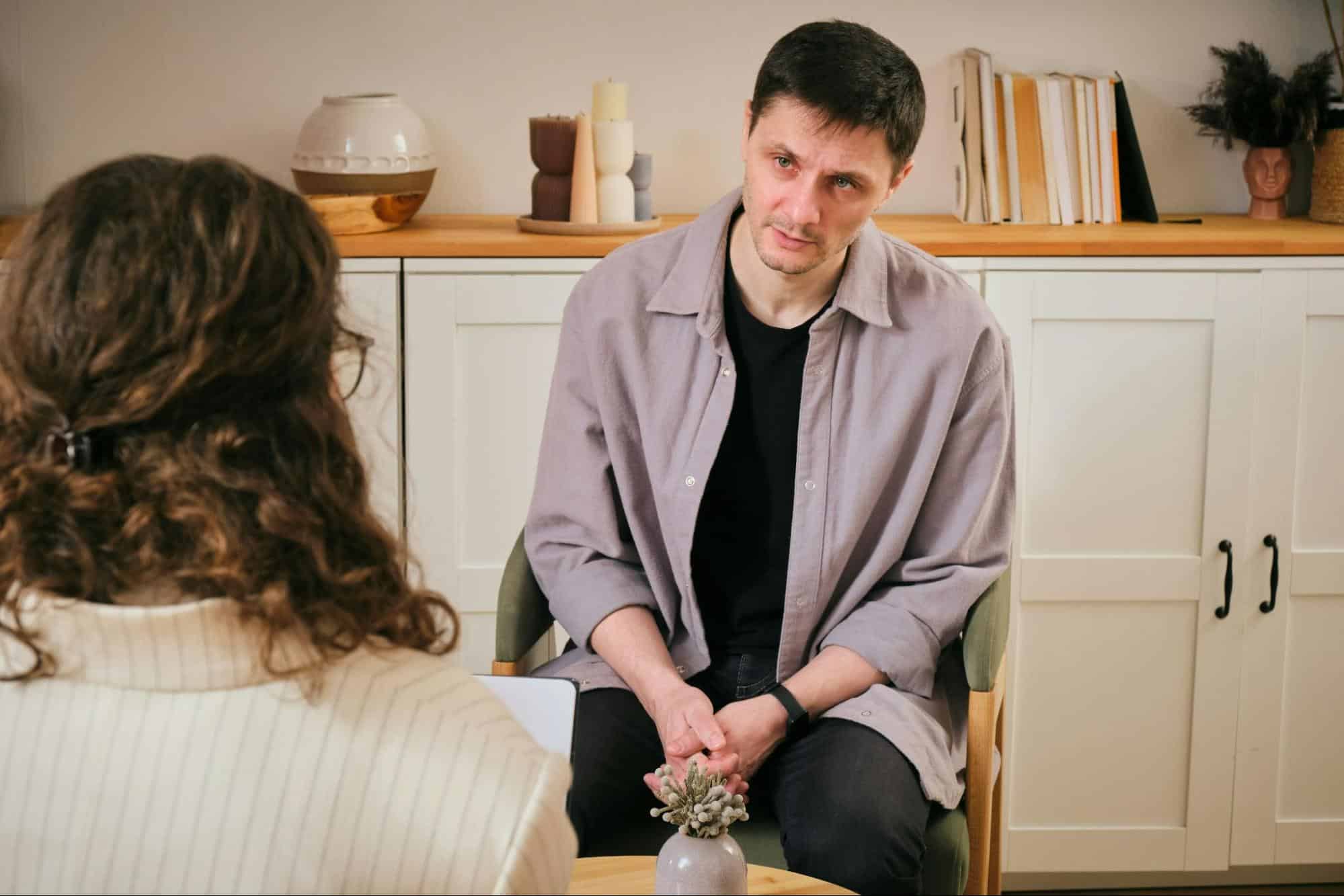 A man looking at the woman