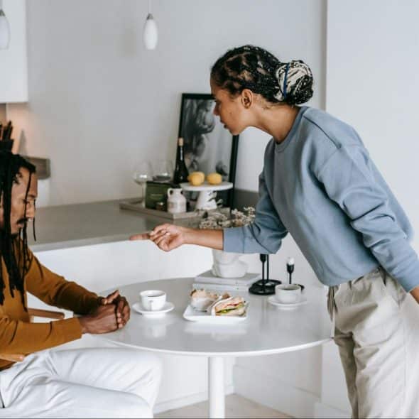 A woman trying to talk with her husband