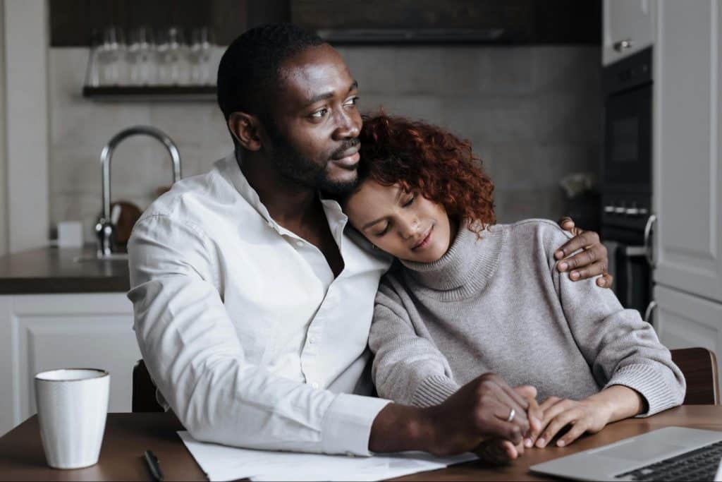 A man hugging a woman