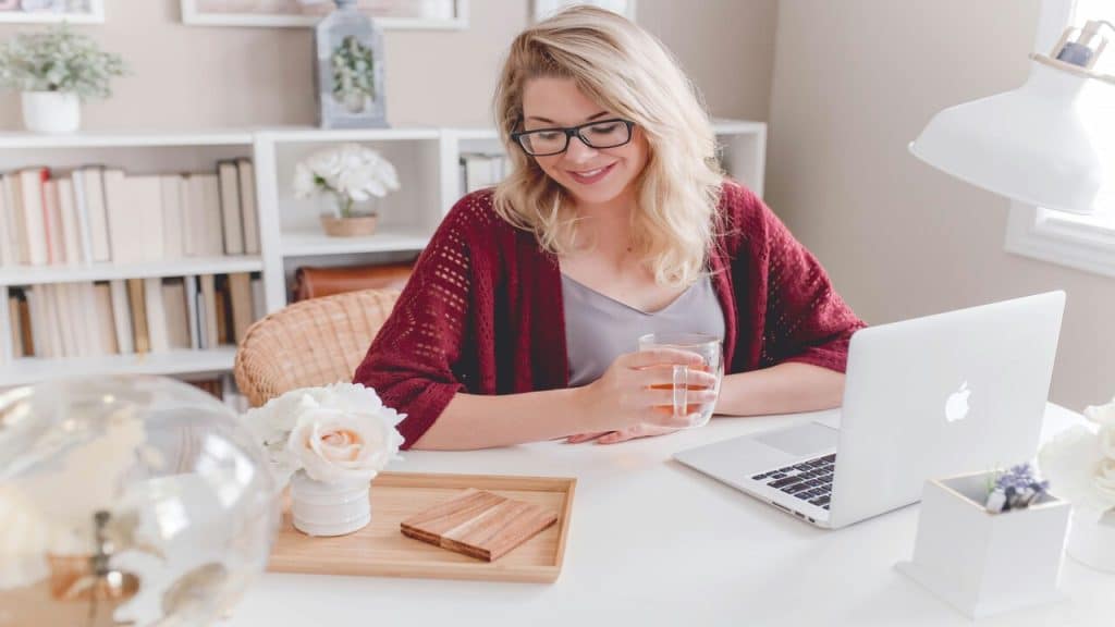 A woman smiling while working 