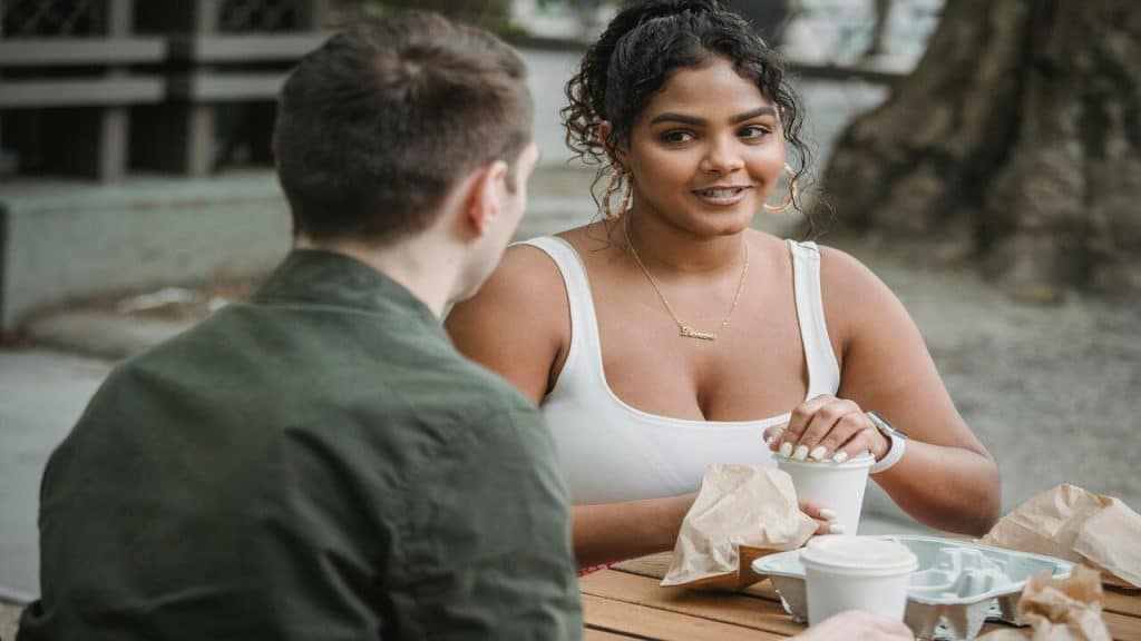 A couple having a picnic outdoors