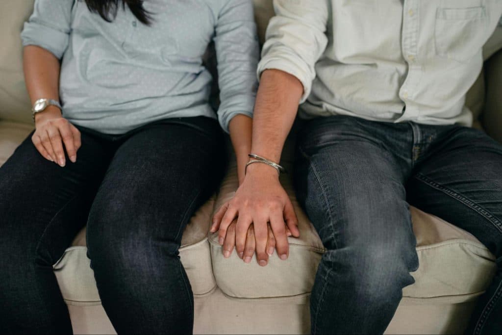 A man and woman holding hands