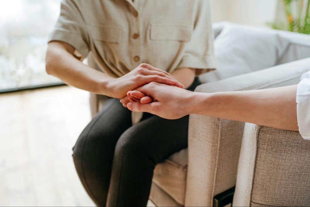 A man and woman holding hands