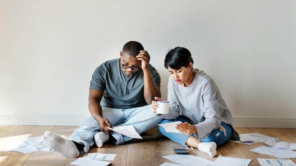 A couple checking financial documents.