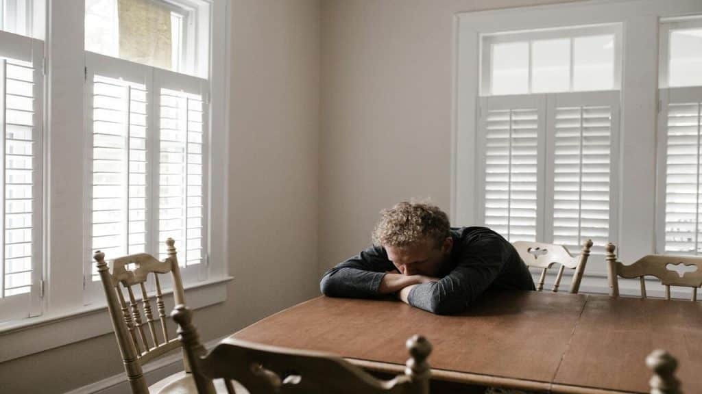 A man leaning on the table