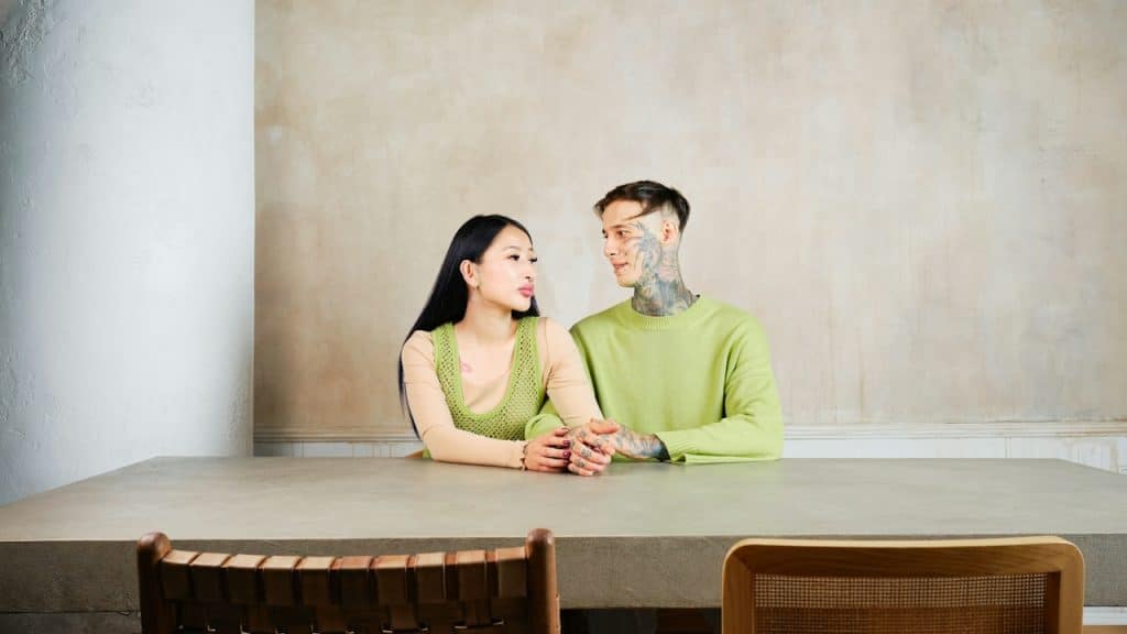 A man and a woman sitting at a table.