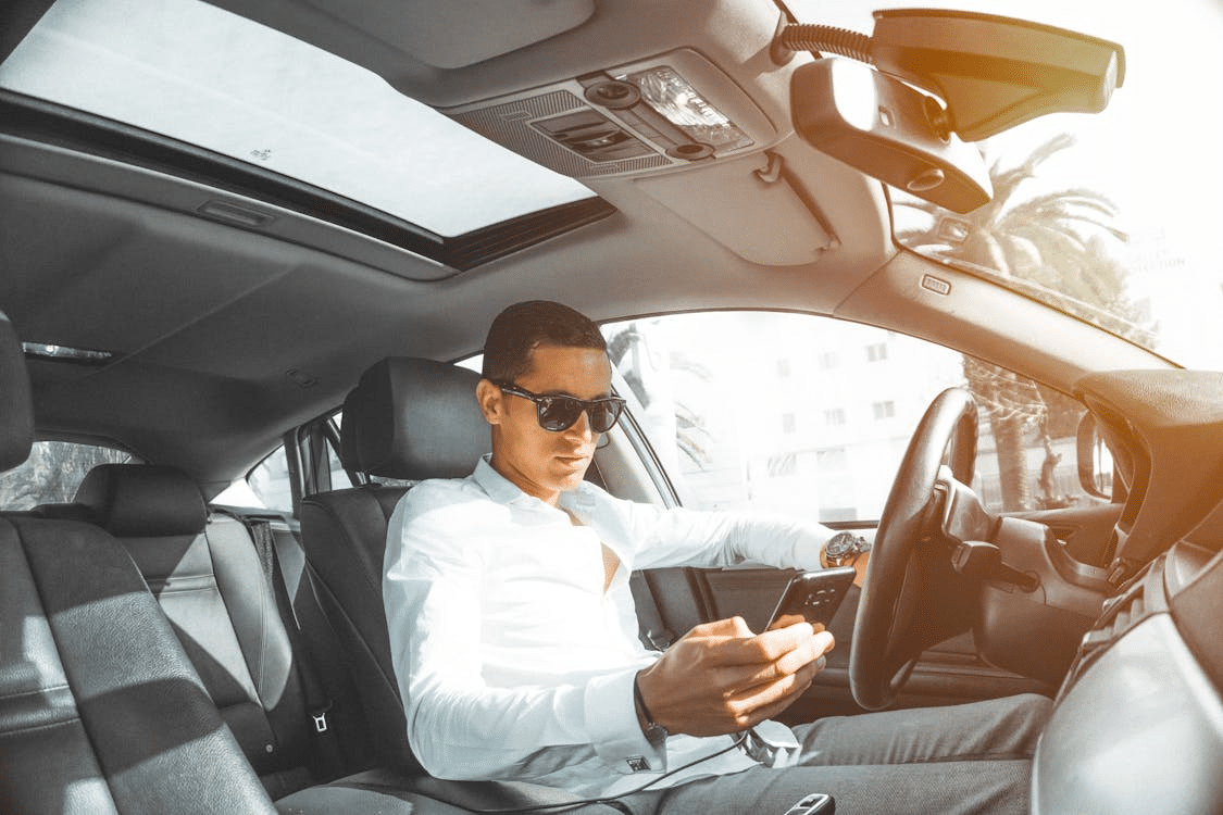 A man driving a car