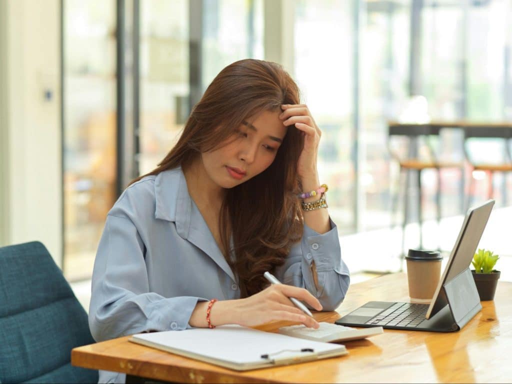 A woman trying to think of a way