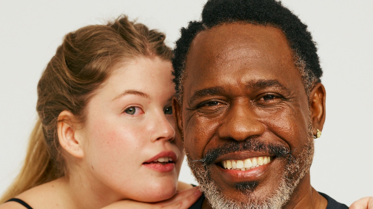 A man and a woman posing for a picture.