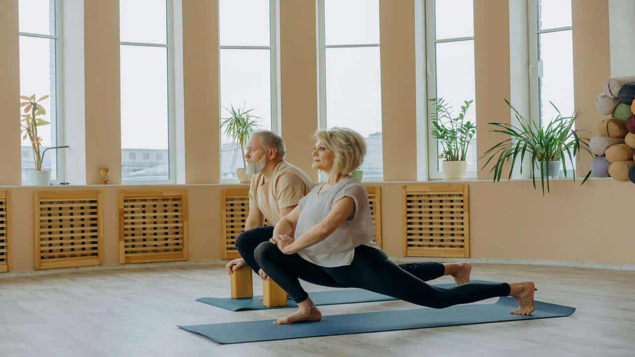 A couple doing yoga together