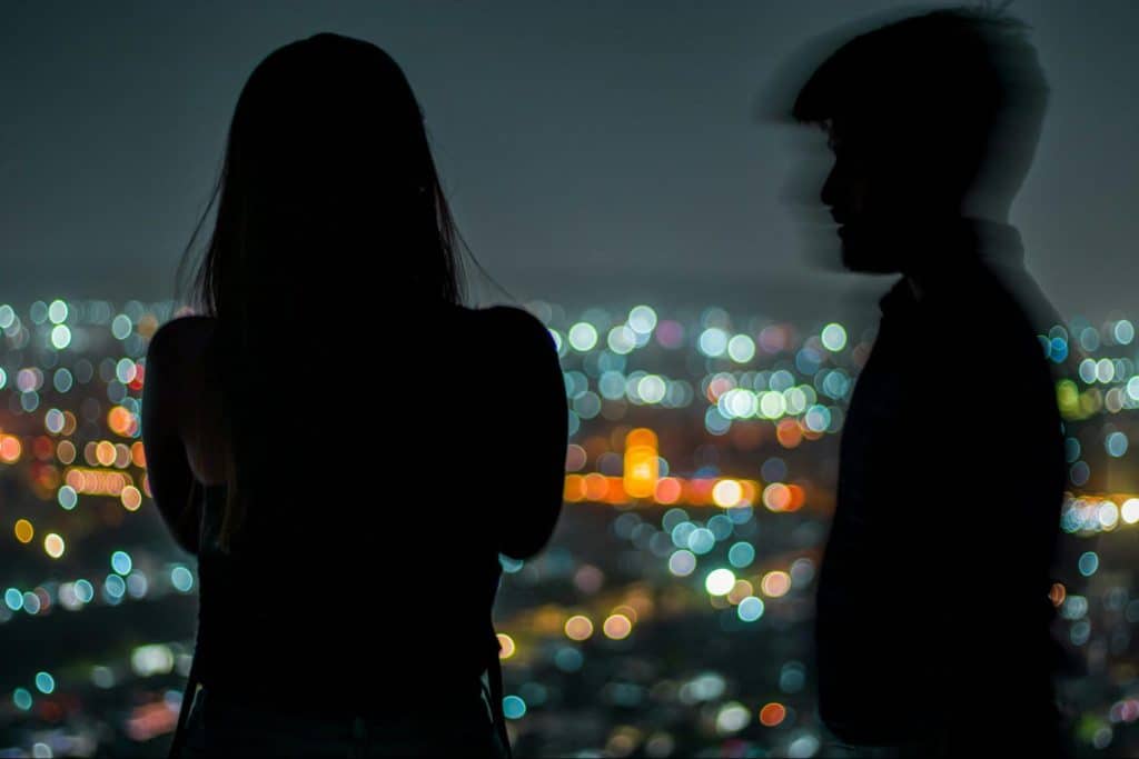 A man approaching a woman