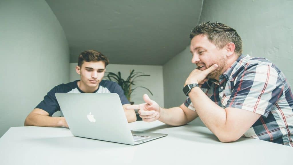 A man mentoring a younger guy