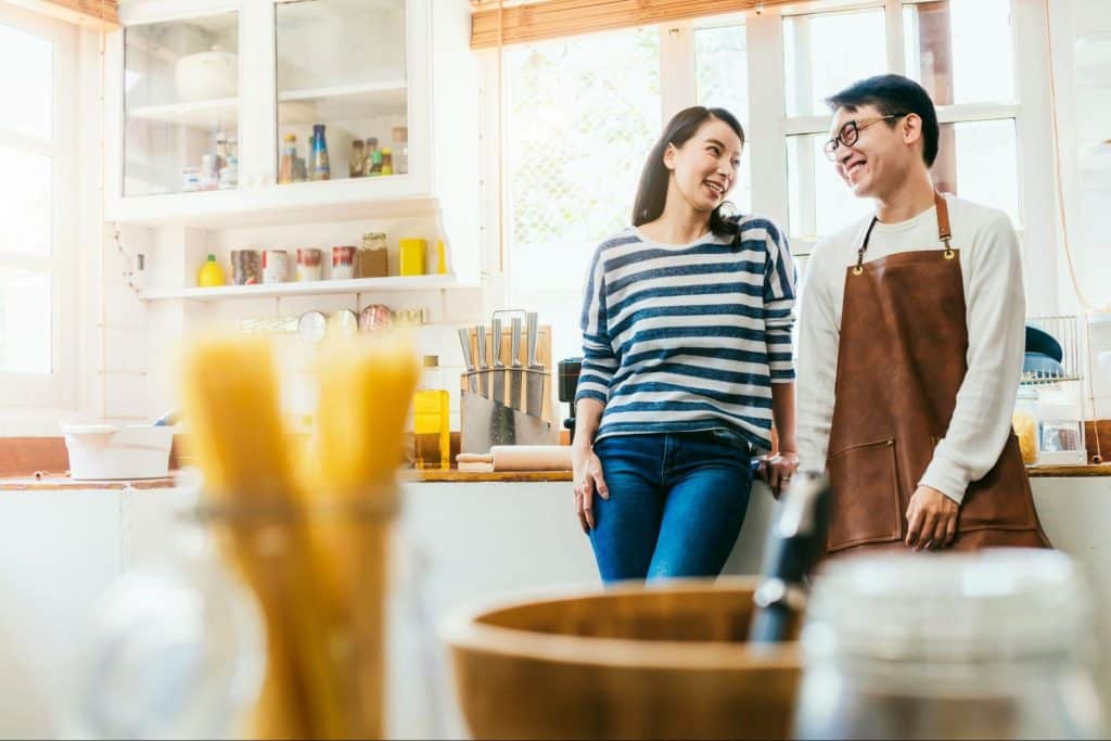 A man and woman at the kitchen