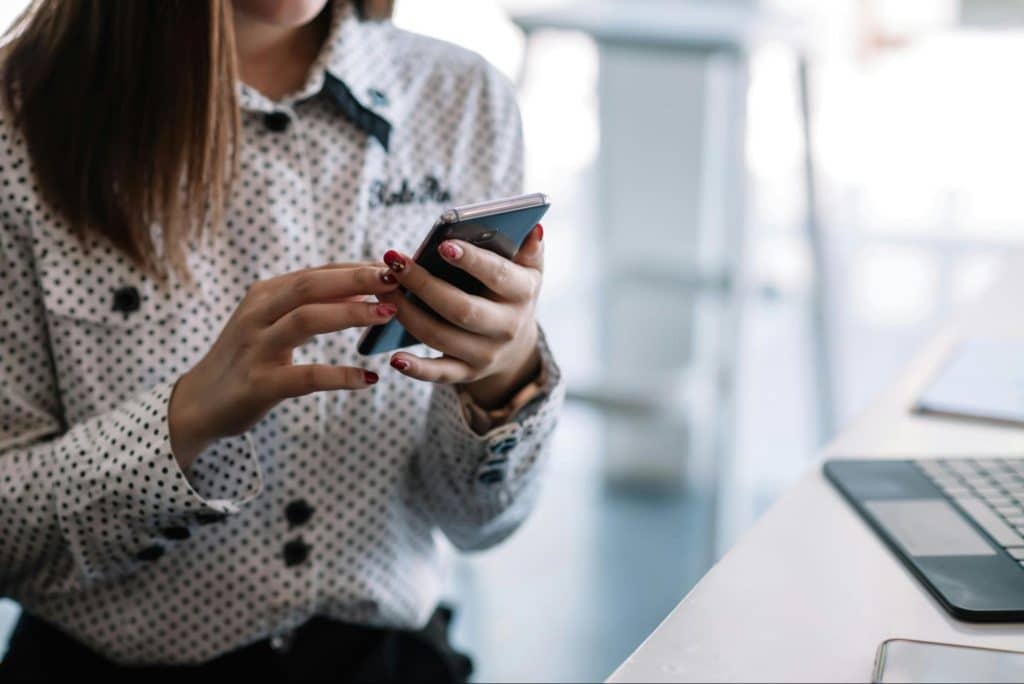 A woman reading a text message