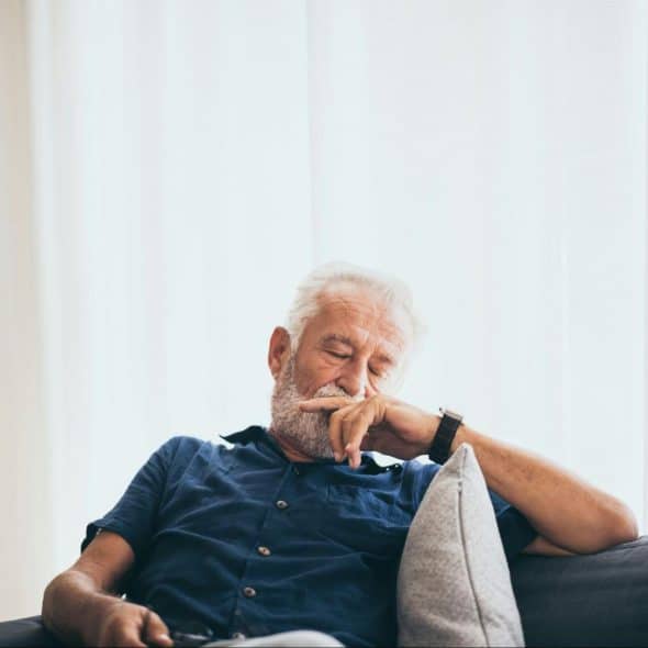 A man sitting at the couch