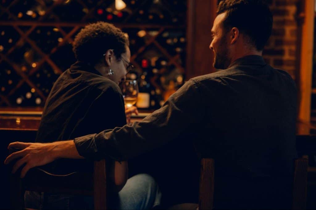 A man listening to a woman