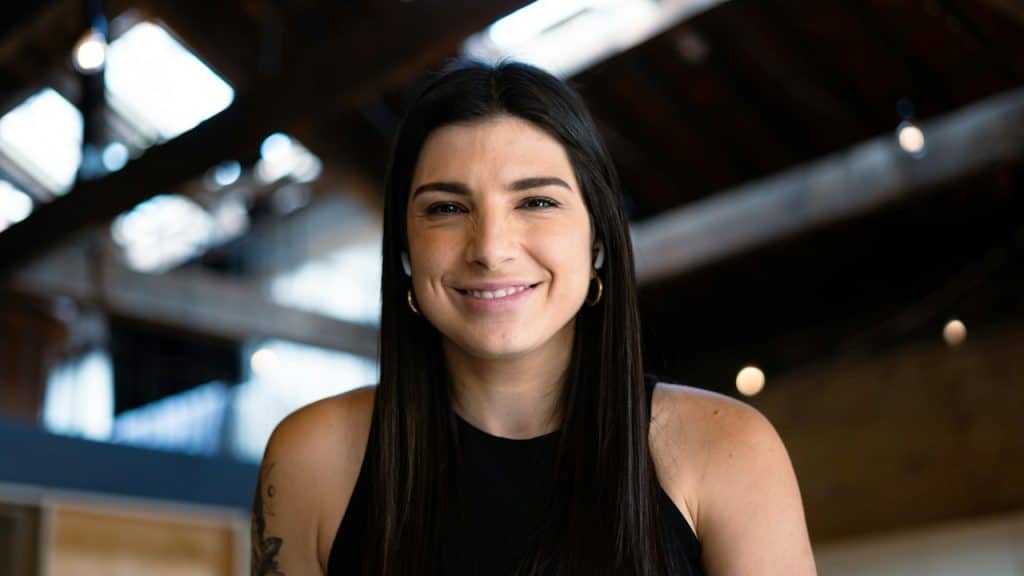 A woman smiling.
