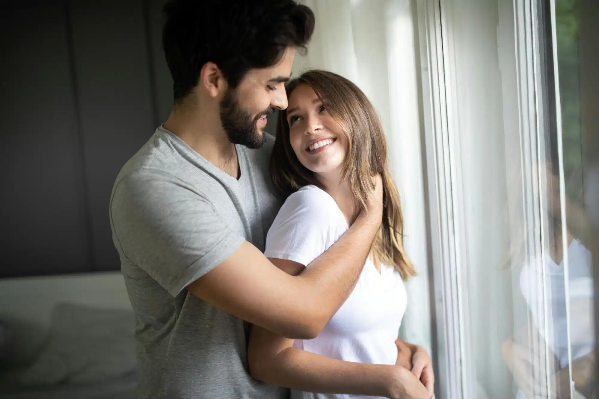 A man and woman at the window