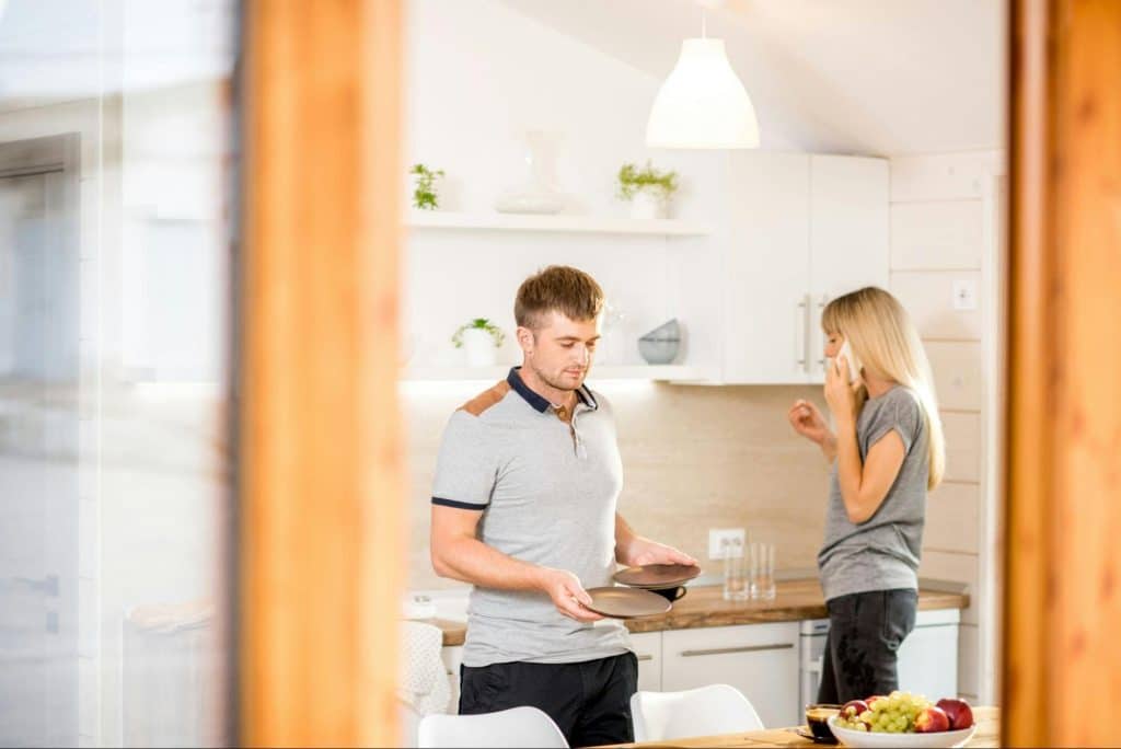 A man and woman at the kitchen