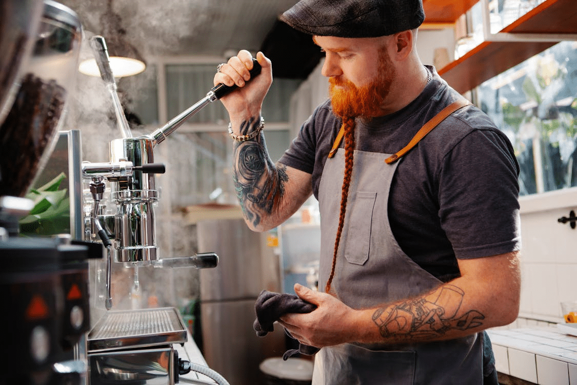A man brewing coffee
