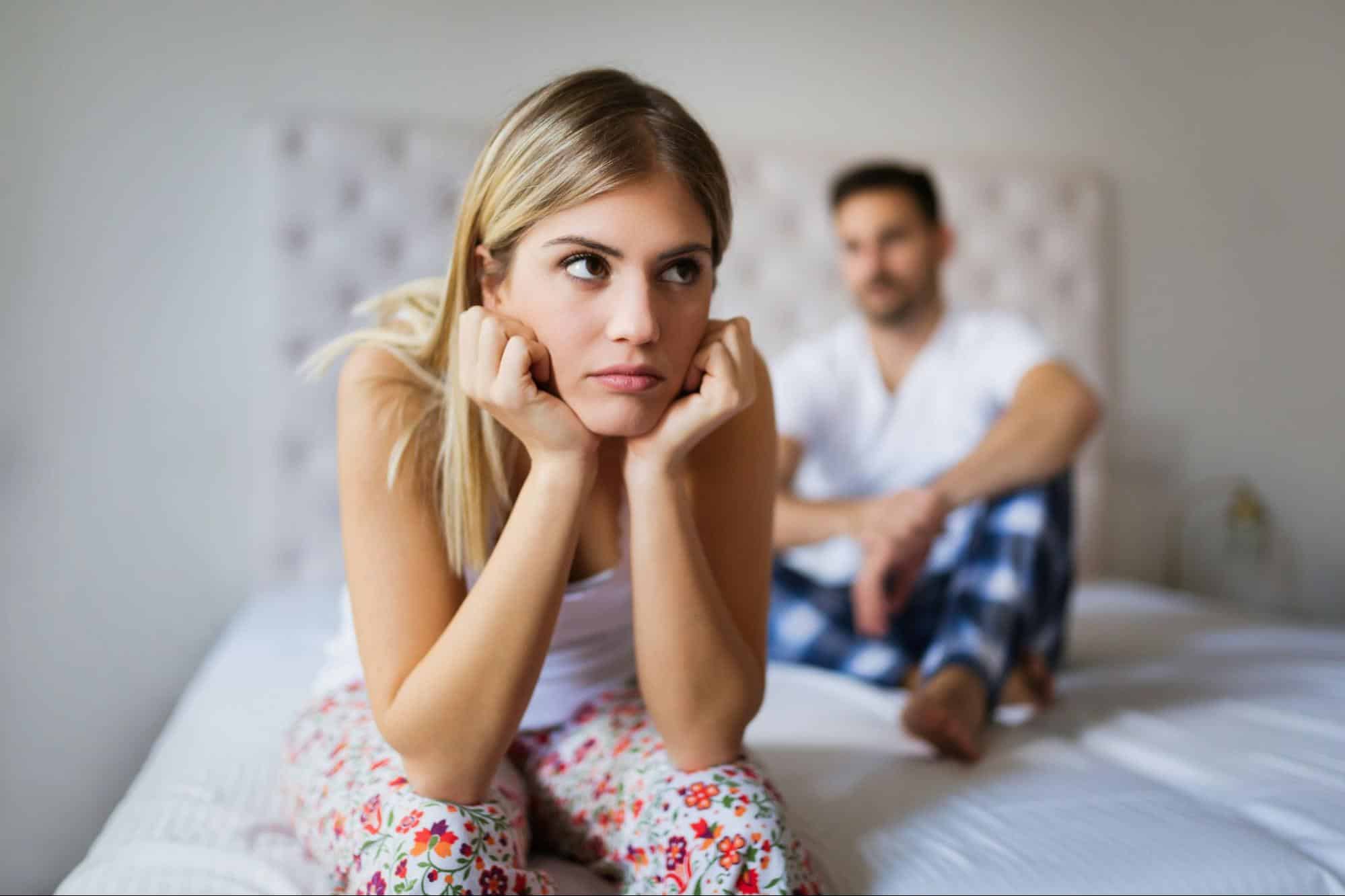 A woman keeping a distance from her boyfriend 