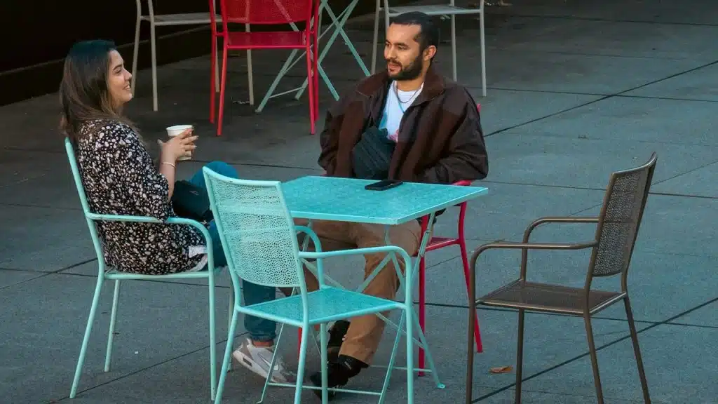 A man and a woman sitting at a table.
