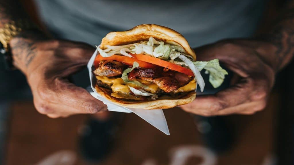A man about to eat a burger