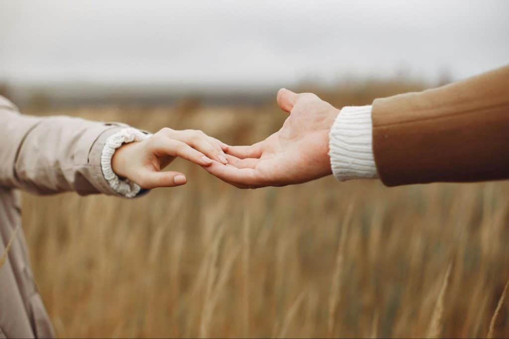 A man and woman holding hands