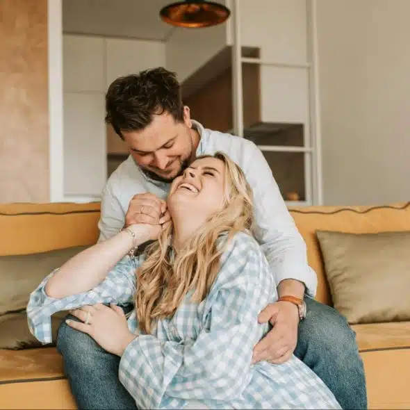 A man and woman laughing together