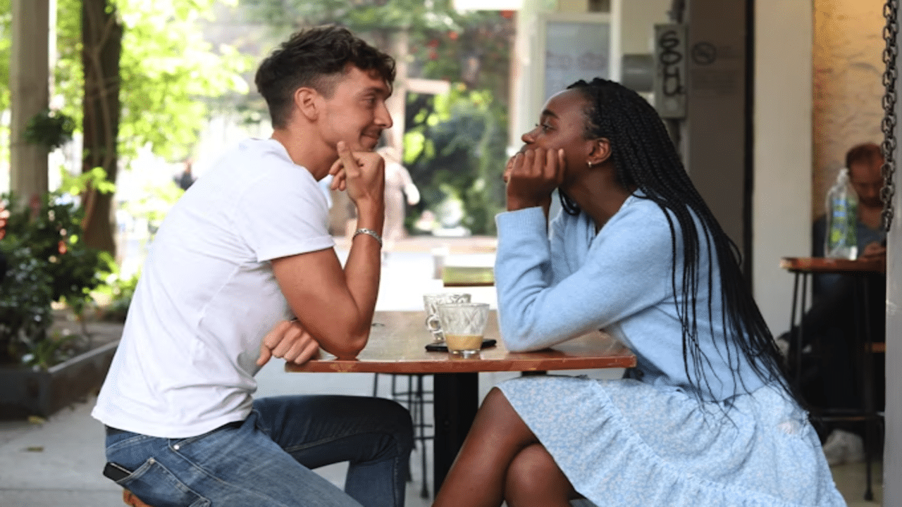 A couple looking at each other during their date