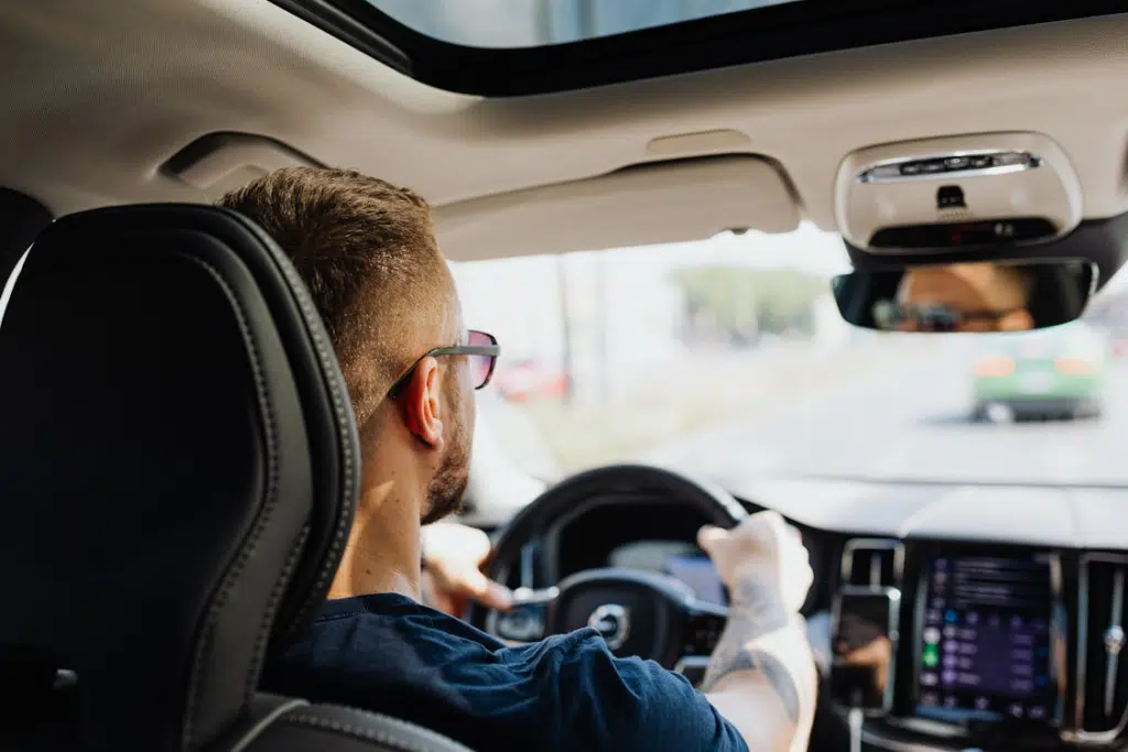 A man driving a car