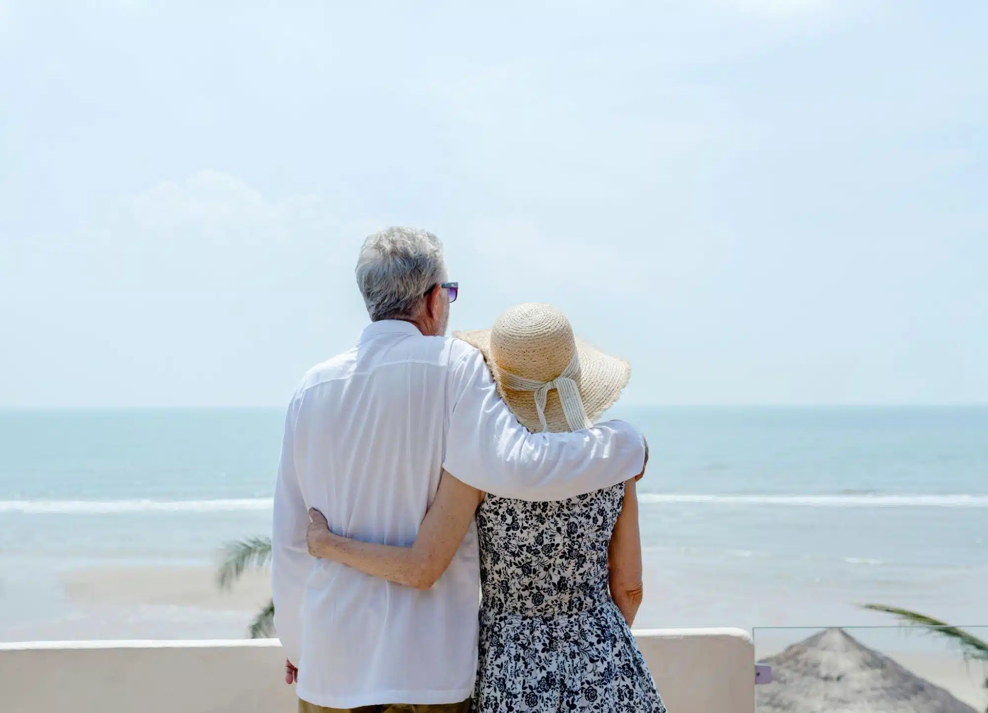 A man and woman looking at the sea