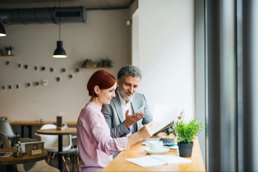 A man and woman talking about work