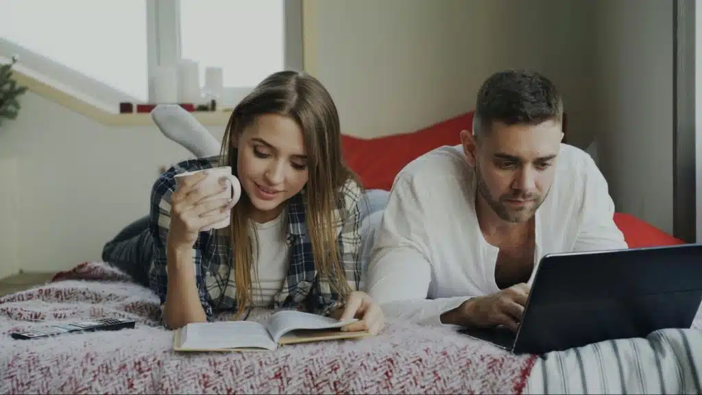 A man and woman at the bed