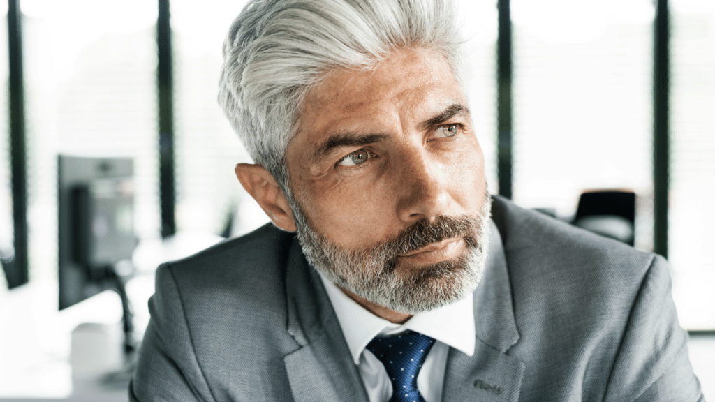 A mature man thinking deeply