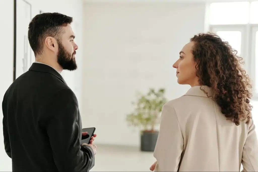 A woman looking at the man