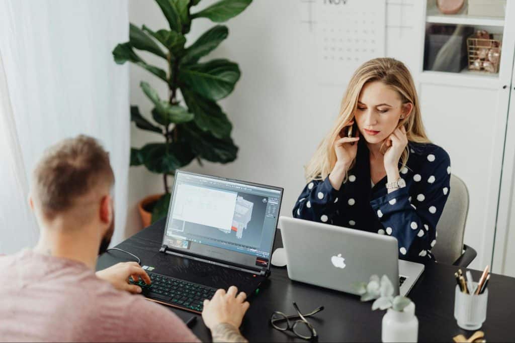 A man and woman working quietly together