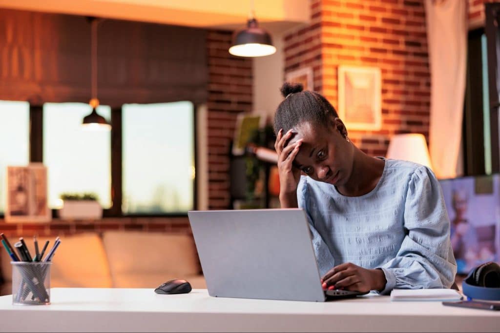 A woman looking at the laptop