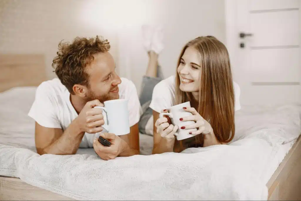 A man and woman at the bed