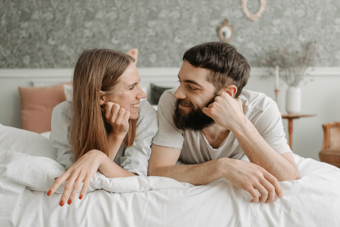 A couple lying on the bed