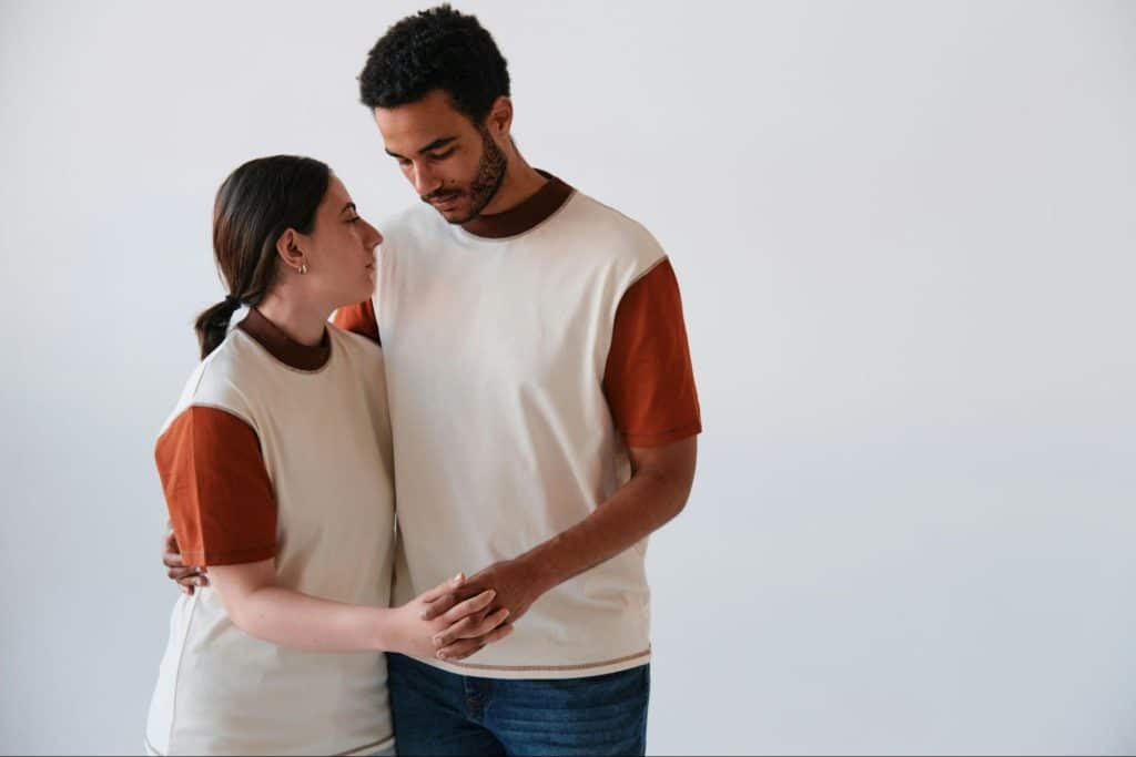 A man and woman holding hands