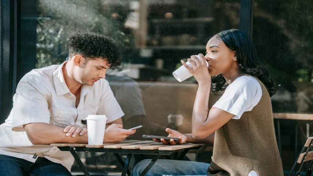 A couple looking serious during a coffee date