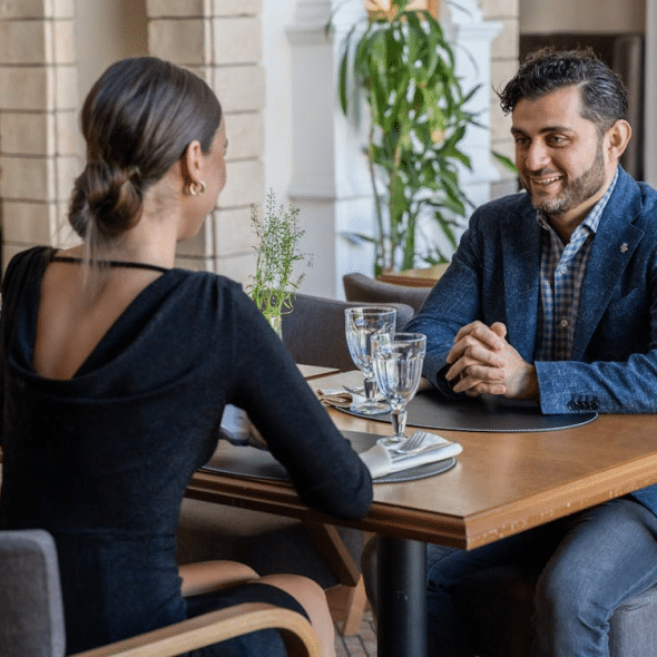 A man and a woman on a date in a restaurant