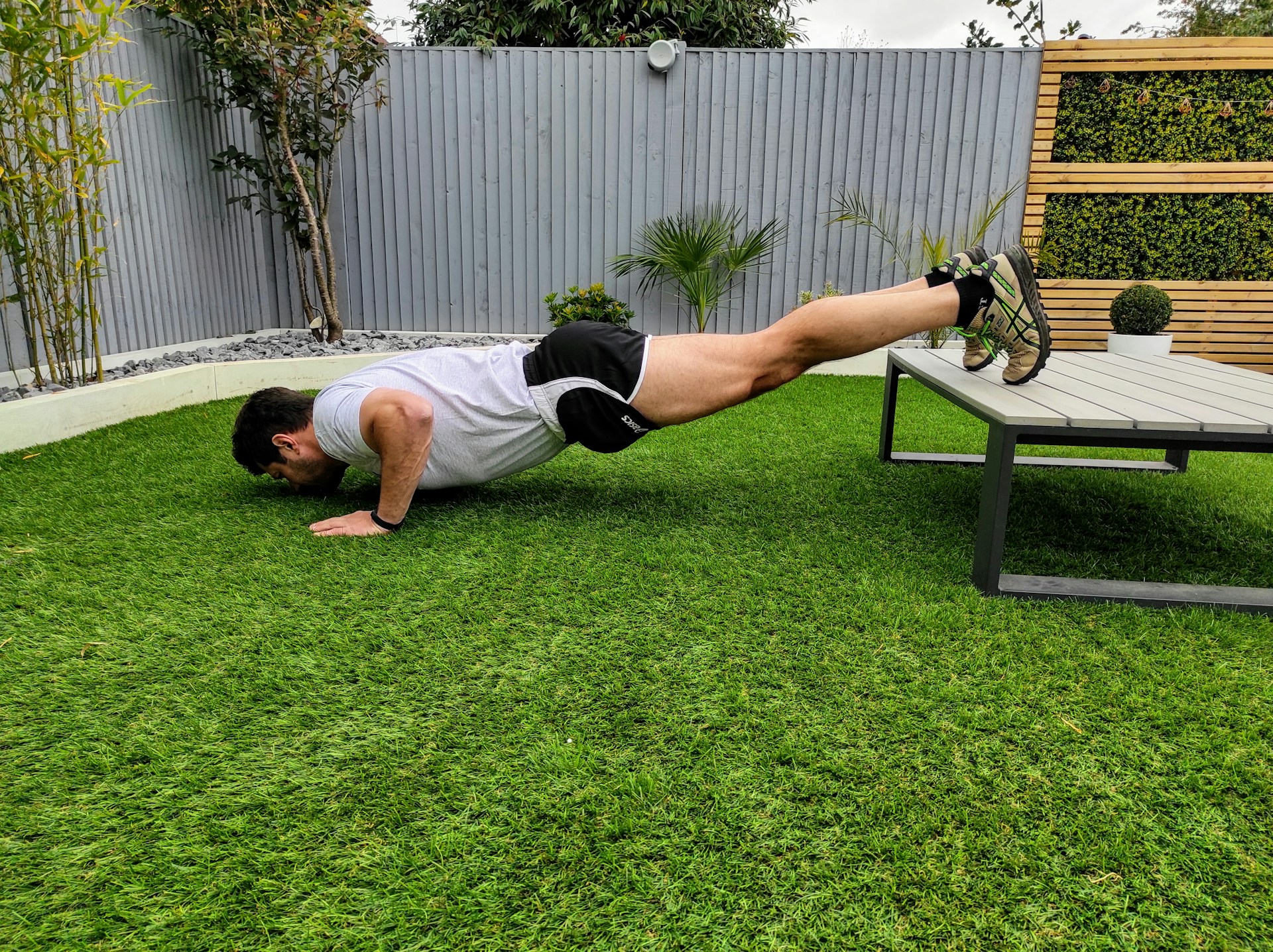 A man doing push ups.