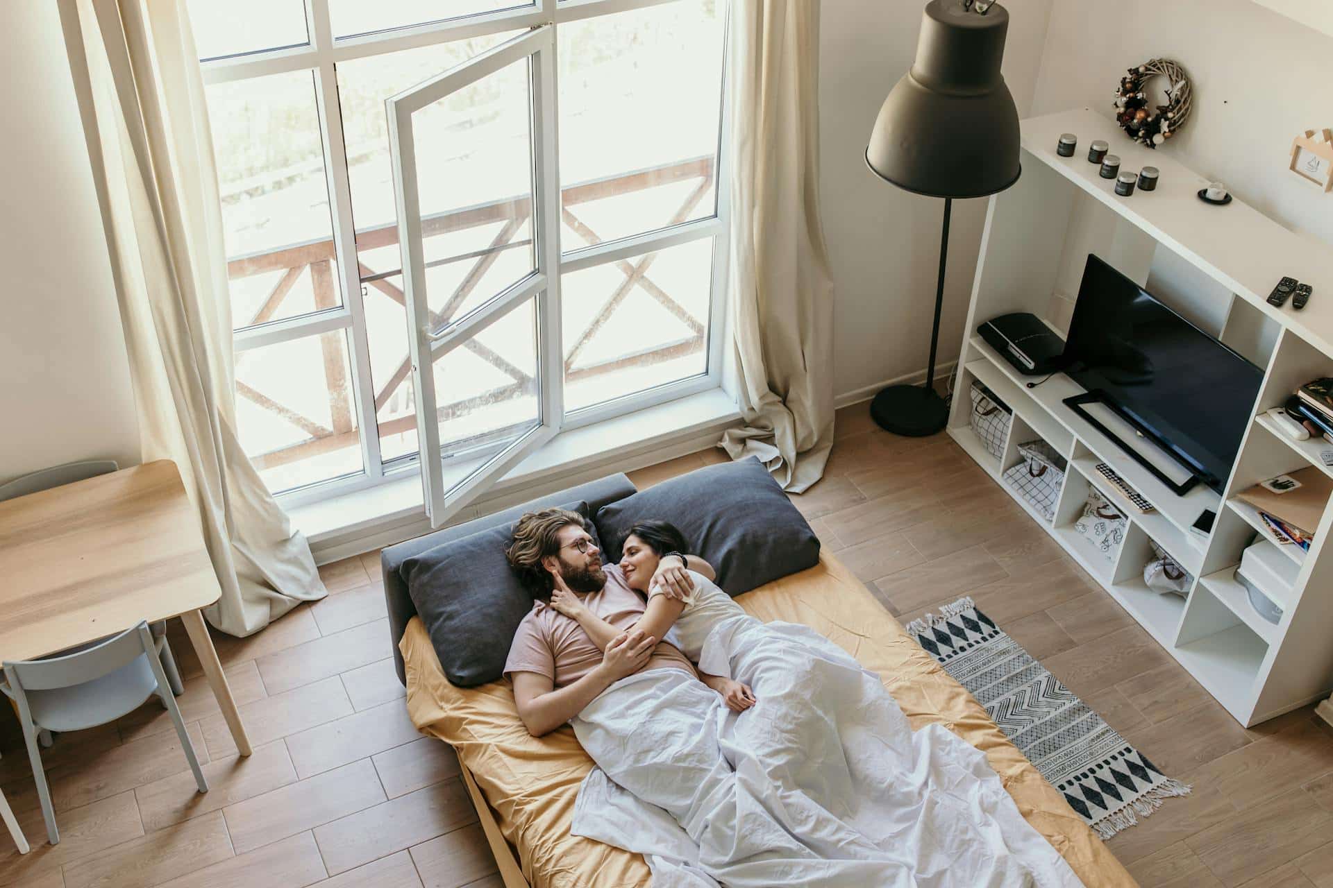 Couple lying in bed together