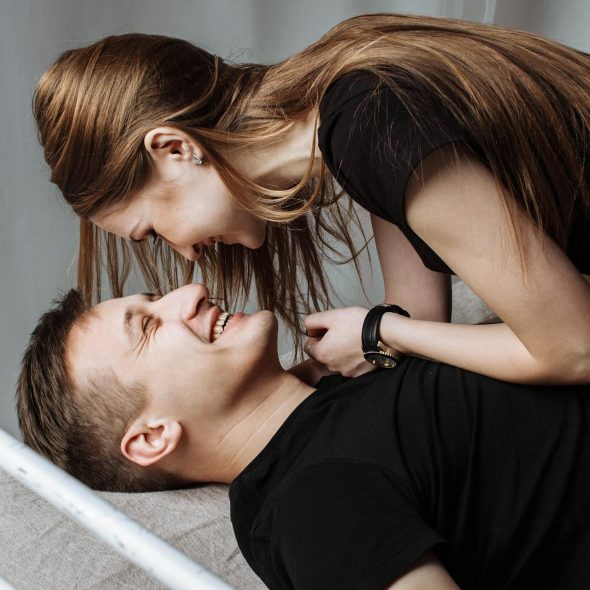 A couple lying in the bed