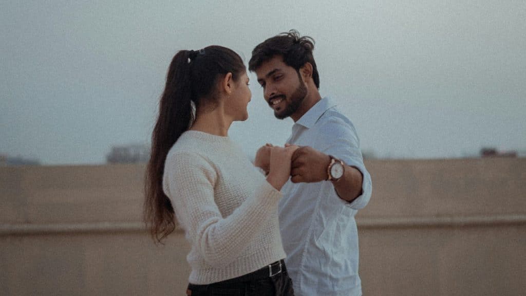 A man and a woman standing next to each other.