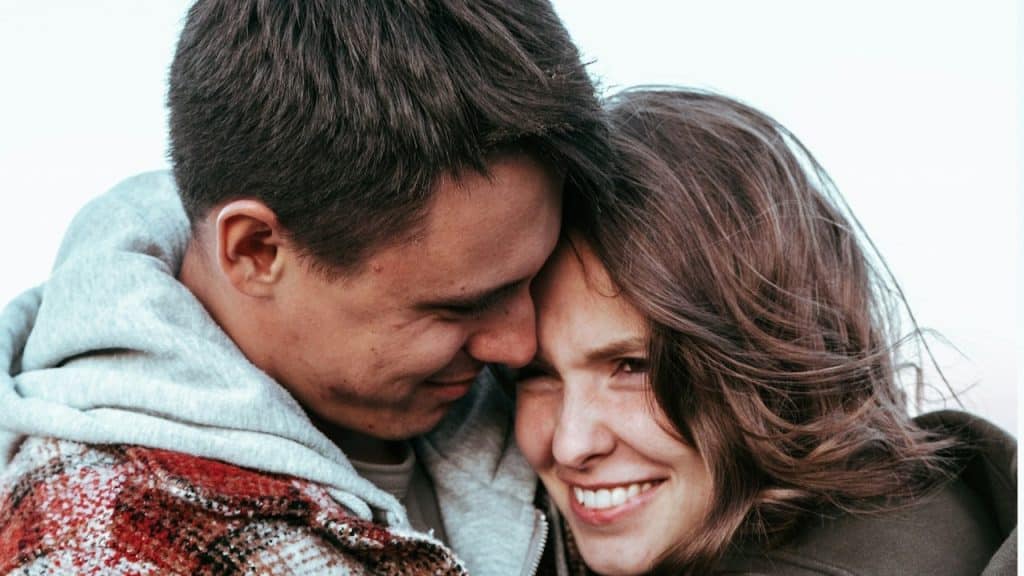 A man and a woman embracing each other.