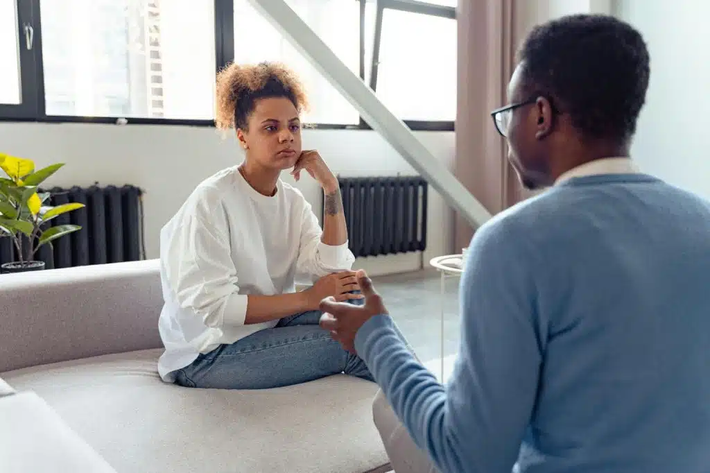 A man and woman talking seriously