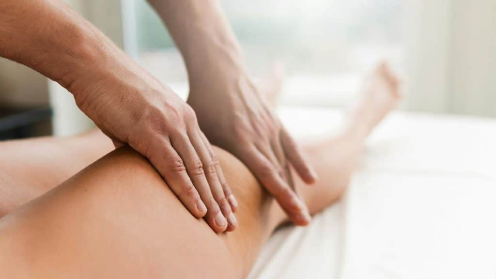 A person receiving a leg massage.